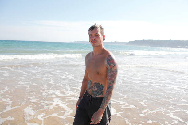 Portrait of a young white man on the beach