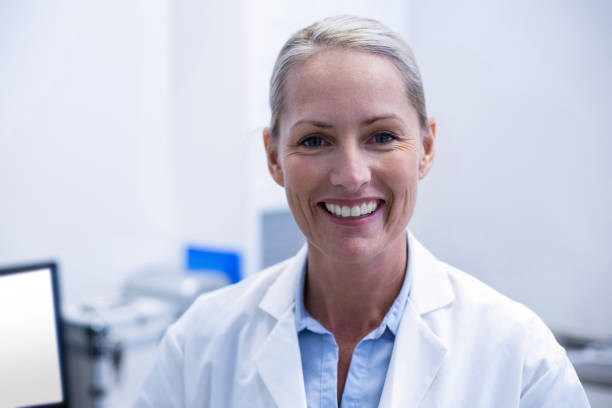 istock Portrait of female dentist smiling 651492596