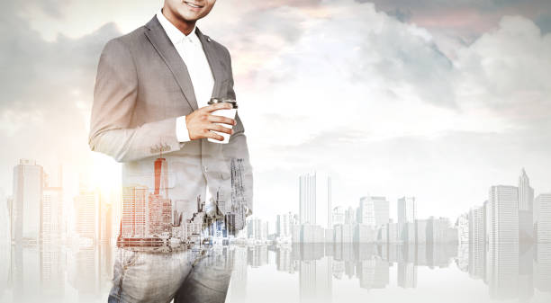 istock Man with coffee and a city, toned 651493410