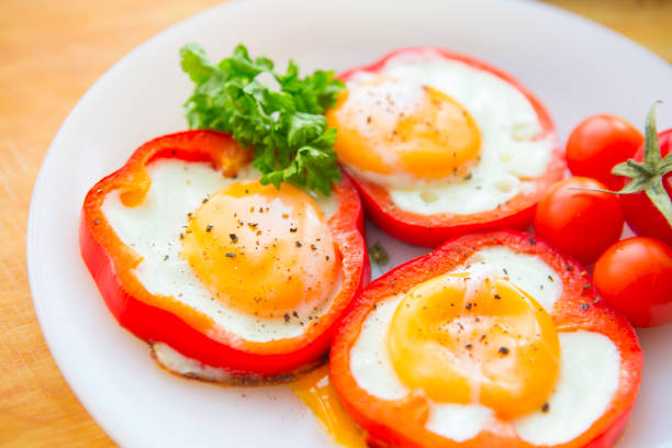 istock Fried eggs in paprika served on white plate 651499280