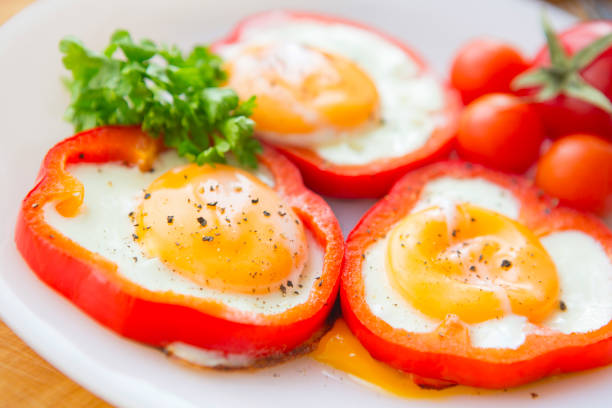 istock Fried eggs in paprika served on white plate 651513028