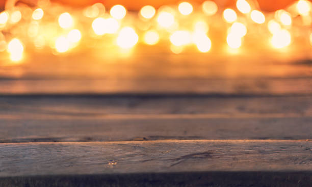istock Abstract christmas light bokeh on wooden background with space 651513590