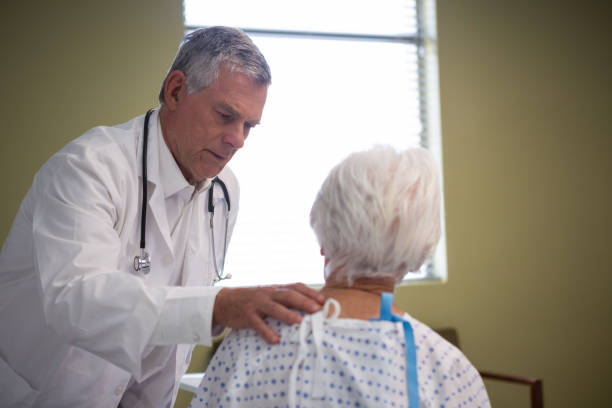 istock Doctor consoling senior patient 651522538