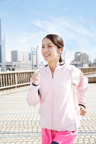 istock Young Japanese women running 651523114