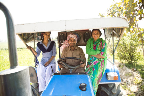 istock Indian family on tractor 651523470