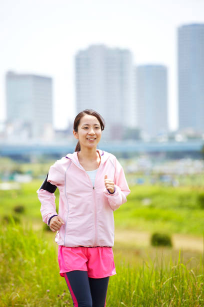 istock Young Japanese women running 651523828