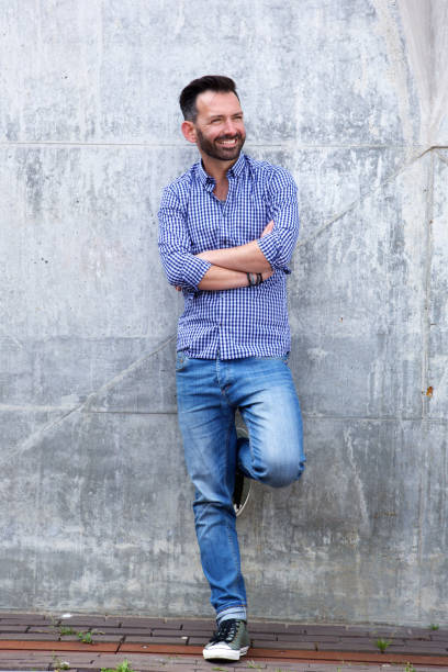 istock Confident mature man with arms crossed 651560024