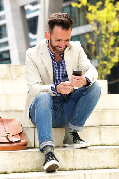 istock Happy mature man using mobile phone 651565960