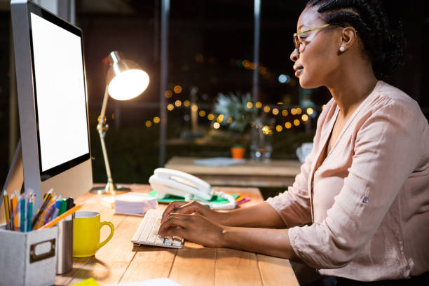 istock Businesswoman working on computer at her desk 651568938