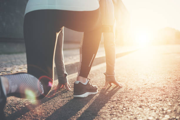istock Athlete woman in running start pose 651635700