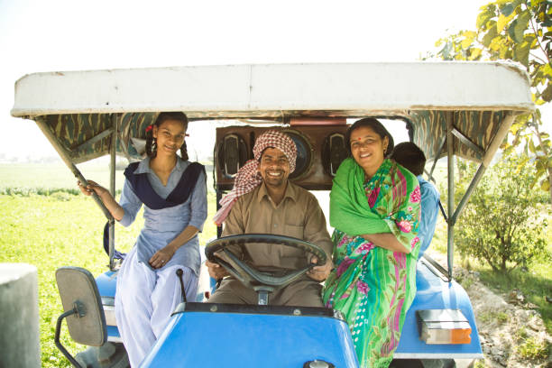 istock Indian family on tractor 651640540