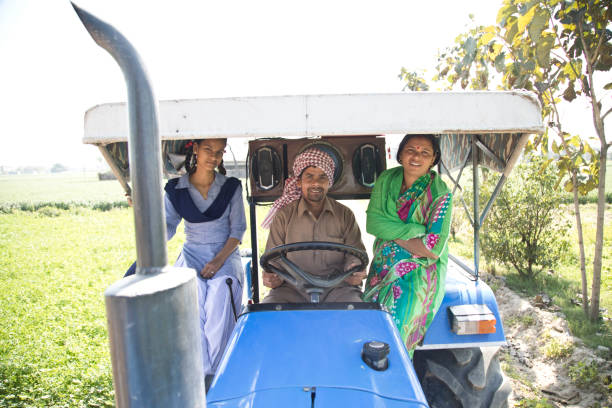 istock Indian family on tractor 651645440