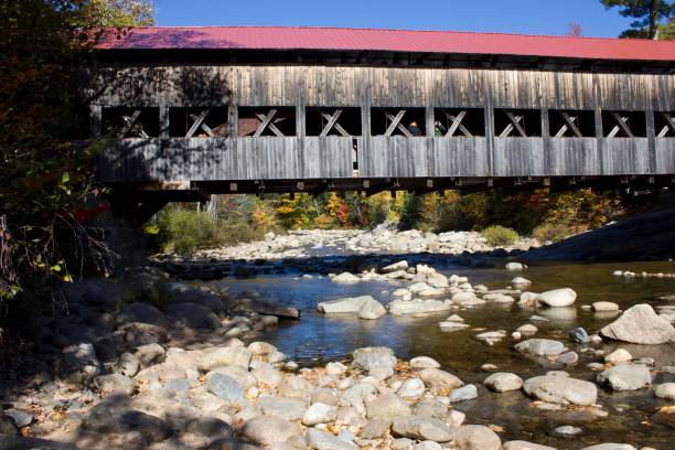 istock Red Roof Bridge Over Water 651648992