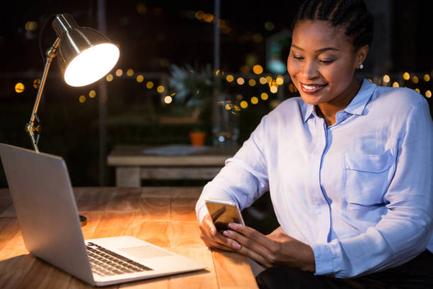 istock Businesswoman using mobile phone at her desk 651656210