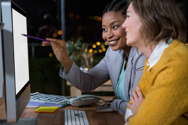 istock Businesswomen working on computer at their desk 651673382