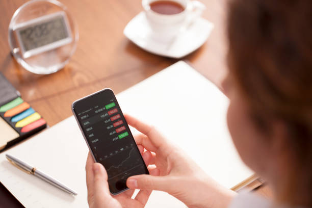 istock Businesswoman using smart phone at desk 651674490