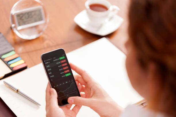 istock Businesswoman using smart phone at desk 651674568