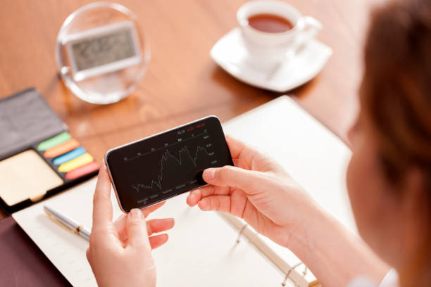 istock Businesswoman using smart phone at desk 651675052
