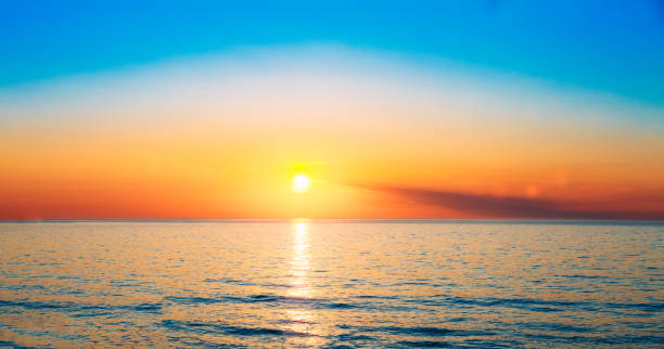 istock Sun Is Setting  Horizon  Sunset Sunrise Over Sea Or Ocean. 651700682