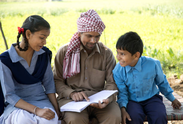 istock Father helping school children to study 651709374
