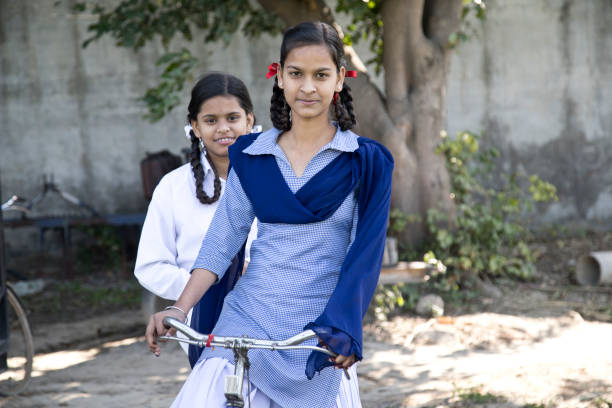 istock Schoolgirls on bicycle 651711630
