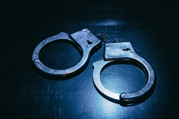 istock Pair of metal handcuffs 651736348