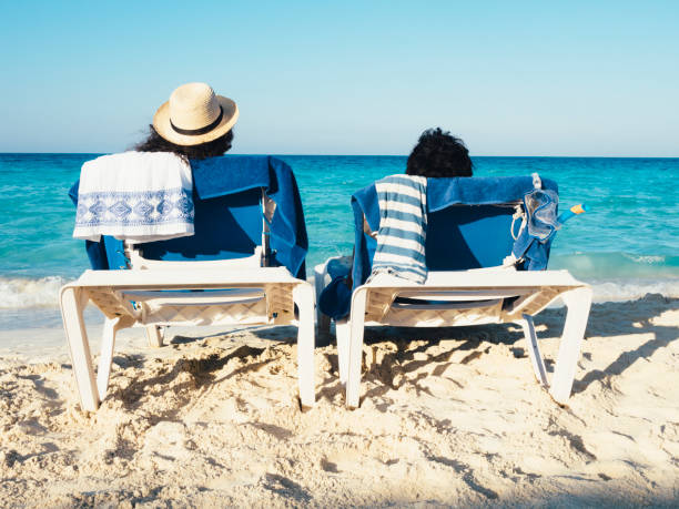 istock Couple relaxing on a beach 651736976