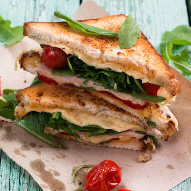 istock Sandwich bread, tomato, lettuce,ham, and yellow cheese 651745634