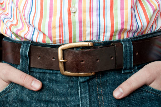 istock Jeans leather belt and shirt with hands in pocket 651745928