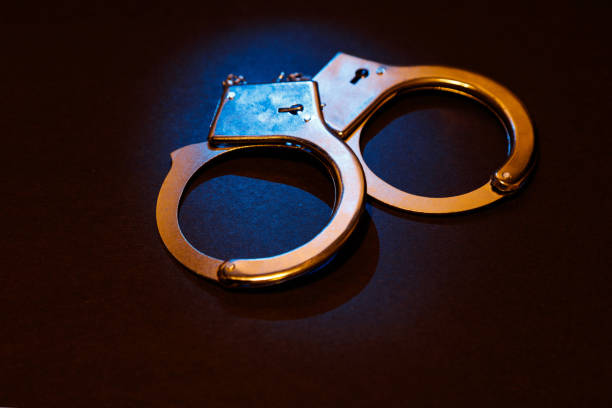 istock Pair of metal handcuffs 651746336
