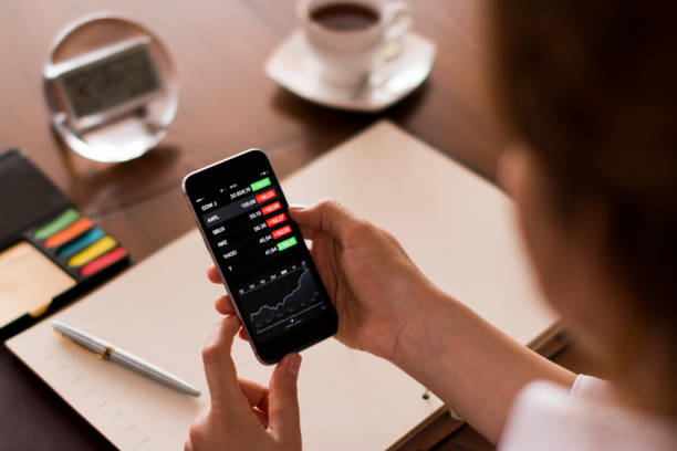 istock Businesswoman using smart phone at desk 651748360