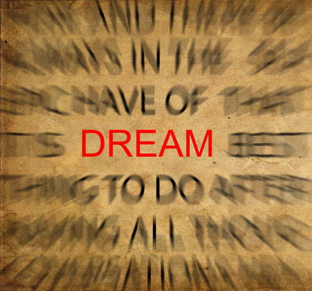 istock Blured text on vintage paper with focus on DREAM 651750190