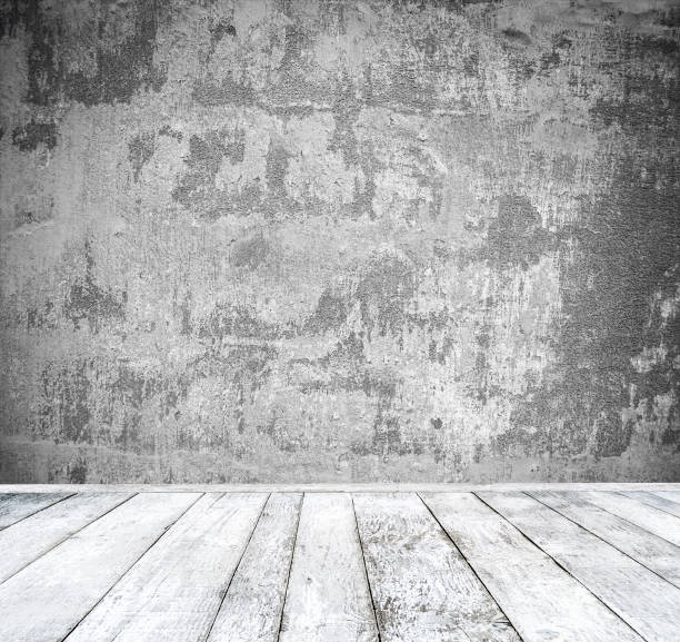 istock Empty room with white wall and wooden floor 651750876