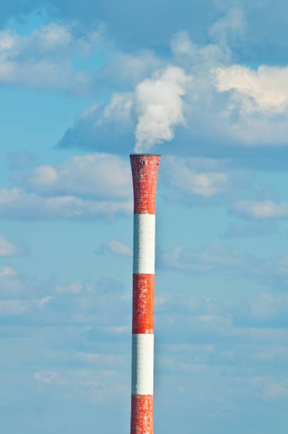 istock Factory pipe smoking with a white smoke over the blue sky 651753242