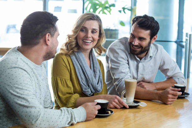 istock Friends interacting while have a cup of coffee 651772572