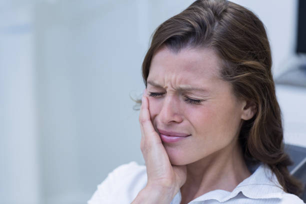 istock Unhappy woman having a toothache 651772594