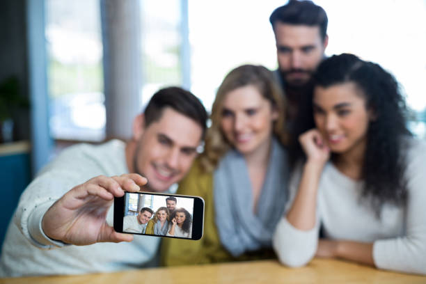 istock Group of friends taking a selfie 651772742