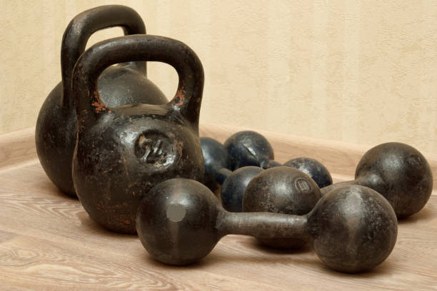 istock Dumbbells and kettlebells on the floor 651773898