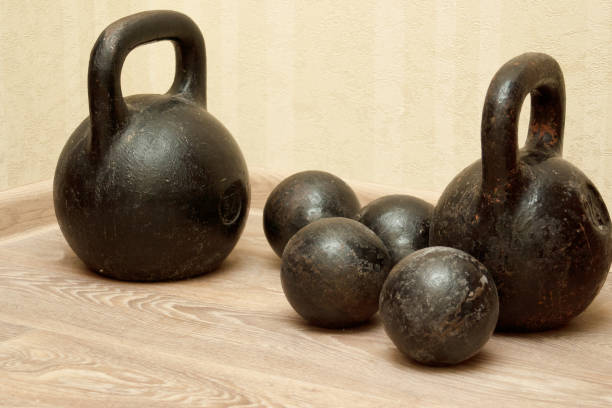 istock Old dumbbells and weights at the gym 651773904