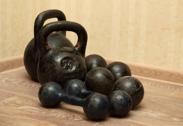 istock Dumbbells and kettlebells on the floor - 2 651773908