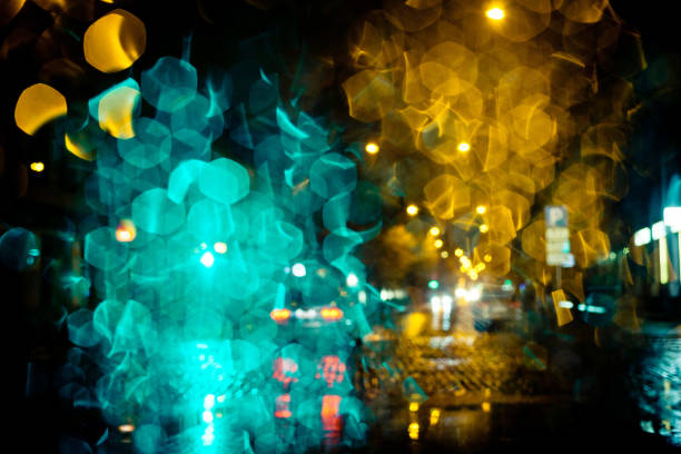 夜の街の通りの光の道 - lighting equipment defocused street light city ストックフォトと画像