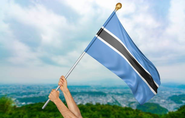 istock Young man's hands proudly waving the Botswana national flag 651776786
