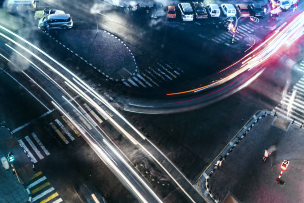 istock aerial view on night traffic at road intersection 651779190