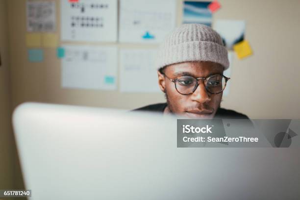 African American Man Working On His Computer Stock Photo - Download Image Now - Candid, Portrait, Student