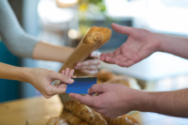 istock Waitress giving parcel to customer at counter 651791398