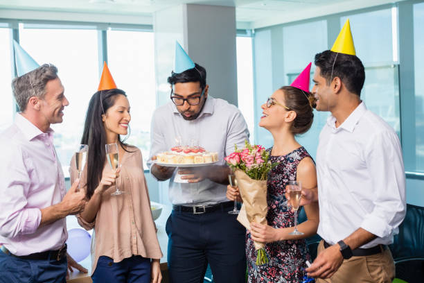 istock Smiling business colleagues celebrating birthday 651793006