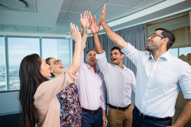 istock Business colleagues giving high five during meeting in office 651794754