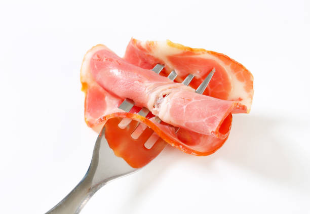 istock Slices of bacon with rosemary 651797998