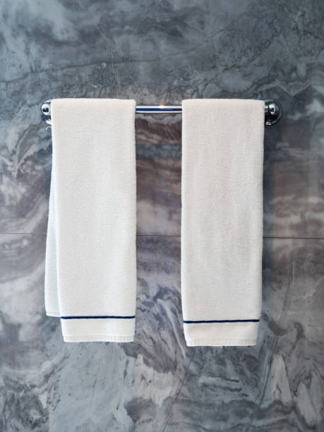 istock Two Clean white towels hanging on hanger 651801738