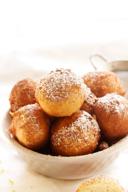 istock Zeppole - Italian Ricotta Donuts on white background, selective focus 651853360
